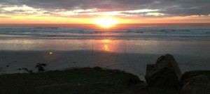 A man was fishing from a beach in Brittany, France. I watched his rods for him as the sun was setting and he prayed.